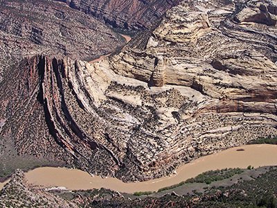The Green River carves the landscape at Mitten Park fault, exposing rock layers formed more than a billion years ago – long before the dinosaurs.