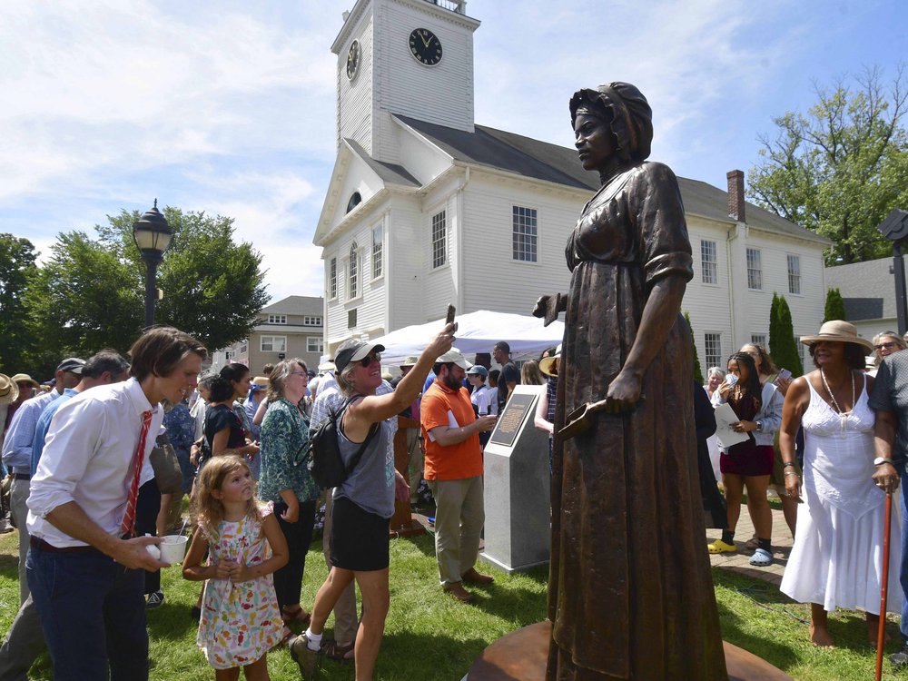 A monument of civil rights pioneer Elizabeth Freeman is unveiled in front of Sheffield's Old Parish Church in Sheffield, Massachusetts.
