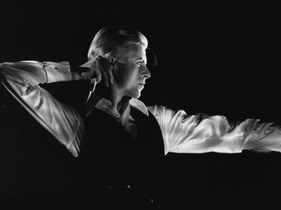 David Bowie performing as the Thin White Duke, one of his personas, during the Station to Station tour in 1976