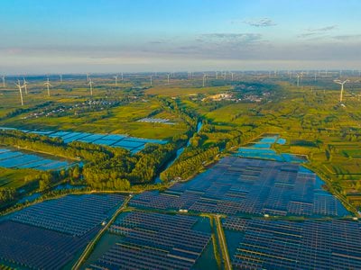 Solar panels and wind turbines in China&#39;s Jiangsu province.&nbsp;