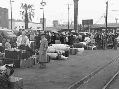 During World War II, Executive Order 9066 authorized the incarceration of 120,000 Japanese Americans (above: In Los Angeles in April 1942, dozens of families wait for a train to Manzanar War Relocation Center in Owens Valley, California).