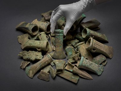 The hoard includes 453 bronze objects, including axe heads, spearheads, sword fragments and bracelets