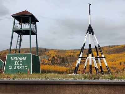 The Nenana Ice Classic tripod is on display alongside the Tanana River and the Alaska Railroad tracks, next to the community "watchtower" building. The tripod will be raised on the ice of the Tanana River on March 5, 2023.