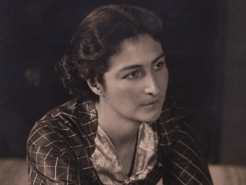 a sepia toned portrait of a woman