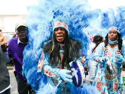 Big Chief Monk Boudreaux (center) leads his Mardi Gras Indian tribe, the Golden Eagles, on Super Sunday.
